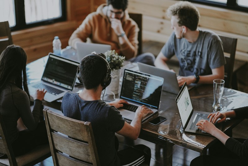 People collaborating openly at the center of a shared creative process