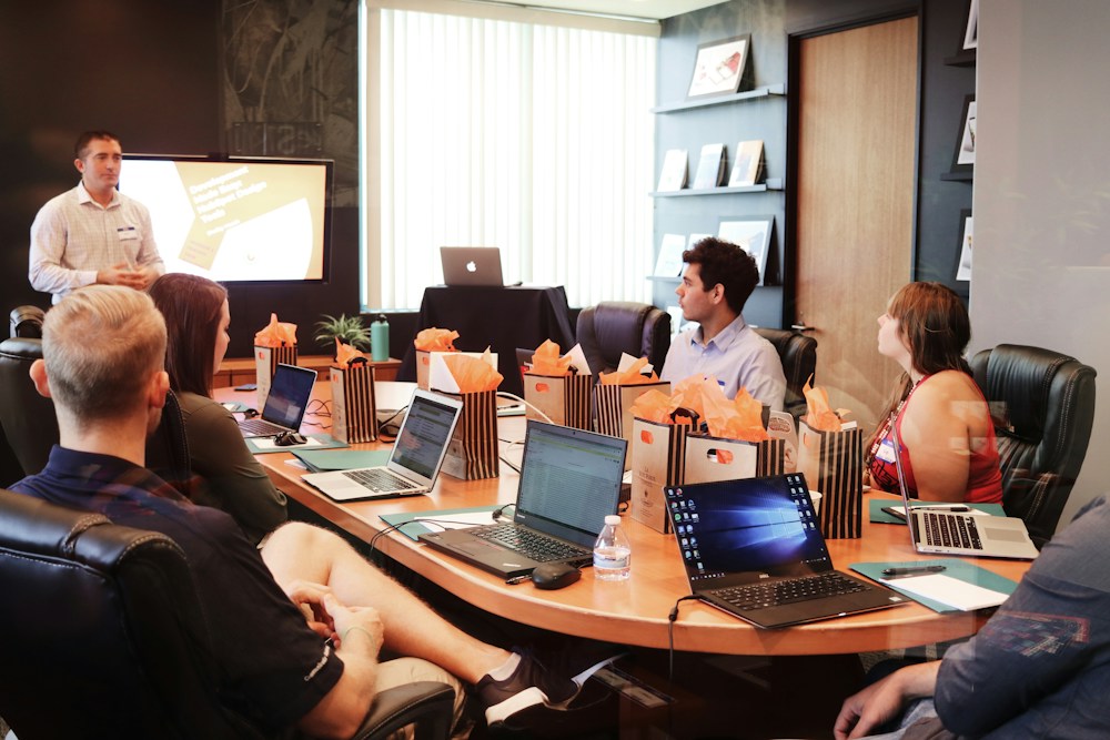 Marketing team discussing how to turn a clear narrative into practical campaign decisions