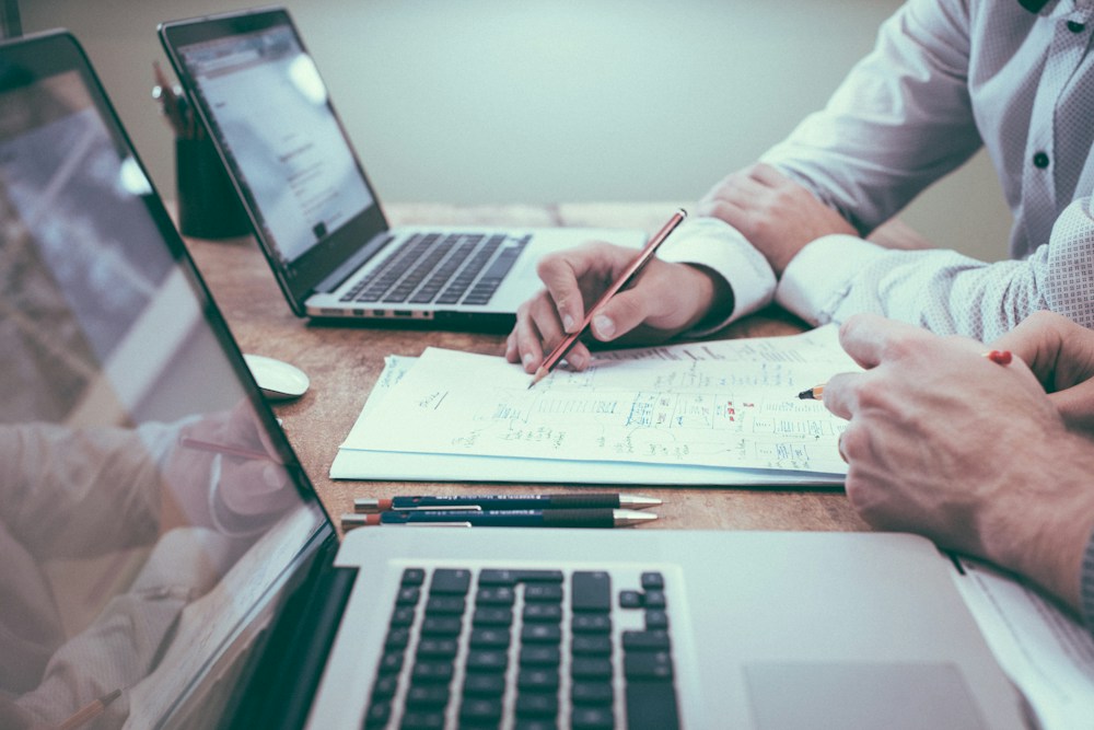 Marketing planning materials and digital tools arranged for connected campaign execution